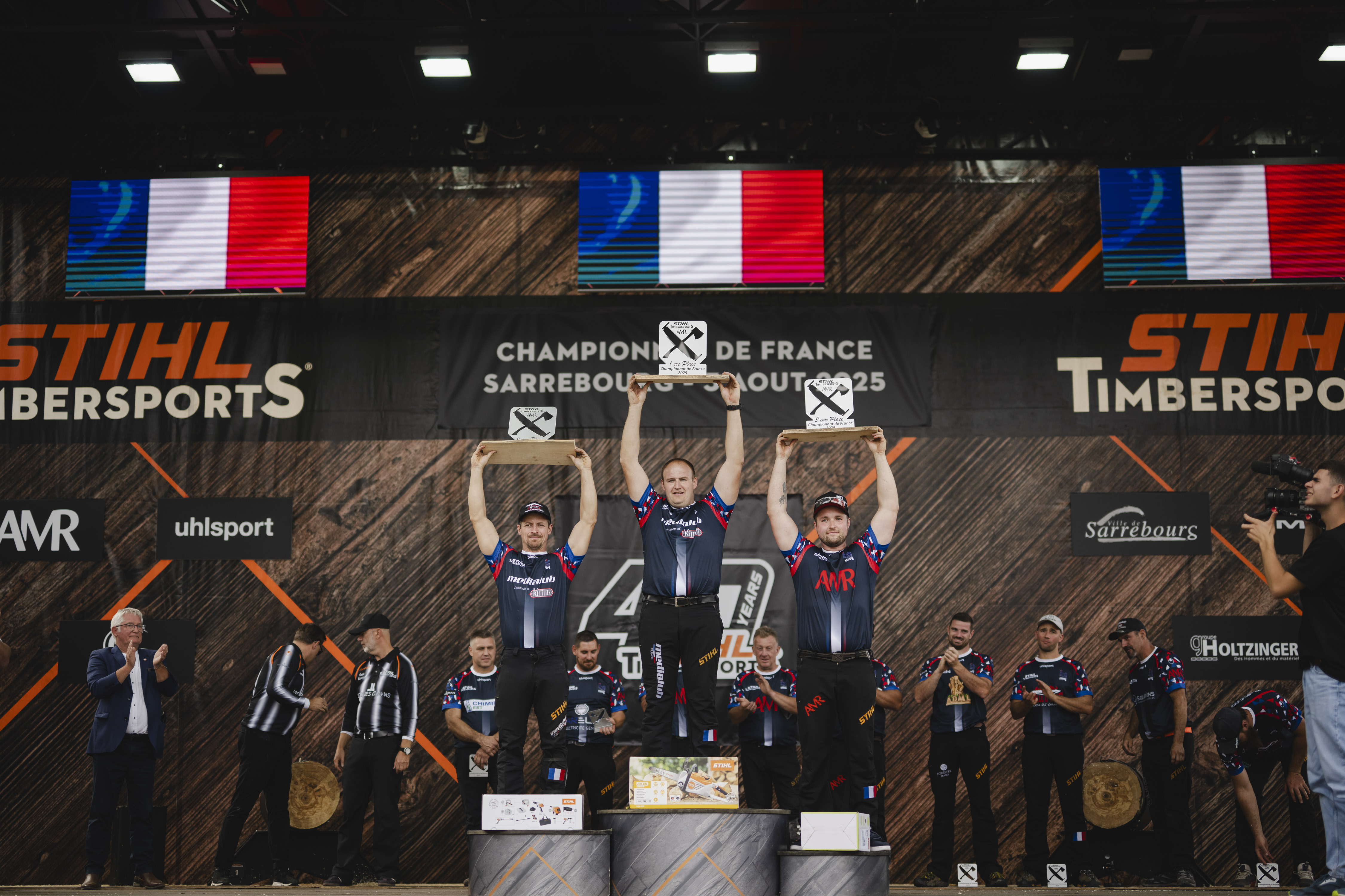Le podium du championnat français Pro 2025.  Alexandre Meurisse (à gauche), Pierre Puybaret (au centre) et Loïc Voinson (à droite).