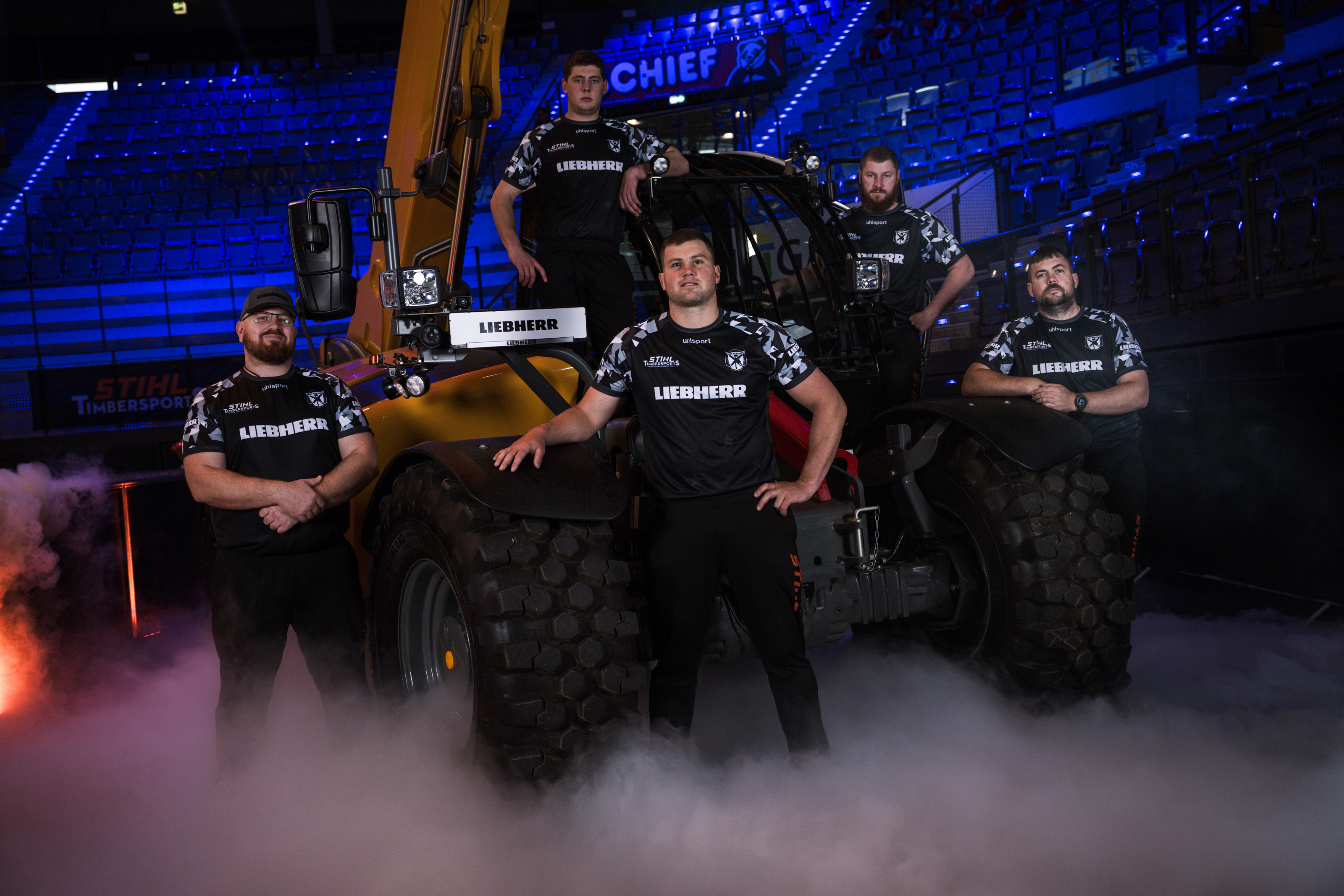 The extreme sports series STIHL TIMBERSPORTS® and the construction machinery manufacturer LIEBHERR are extending their partnership until 2026. LIEBHERR will remain the main sponsor of  the World Championships and sponsor of the World Trophy and European Trophy. Pictured: Team New Zealand at the 2023 World Championships in Stuttgart.